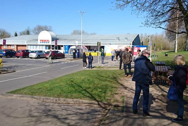 Shoppers were queueing in the car park this morning (Wednesday). Picture: John Aron.