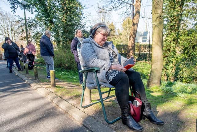 One woman takes a seat while waiting for her prescription.