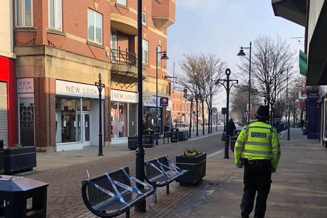 Police have taped off Boston town centre benches