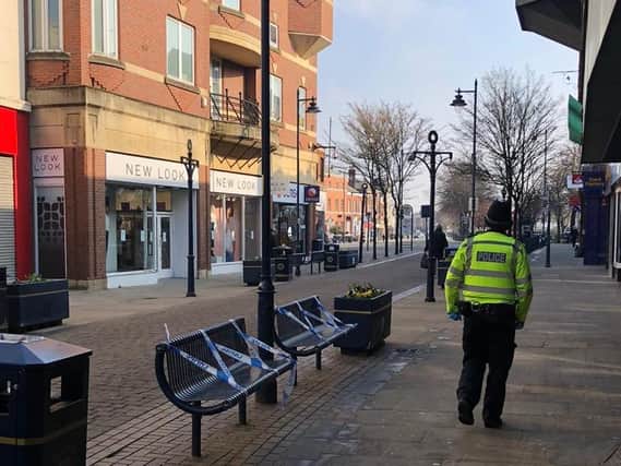Police have taped off Boston town centre benches