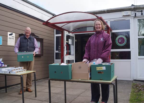 Mike May from Market Rasen New Life Church and  teaching assistant Karen Moulding with some of the boxes EMN-200330-170203001