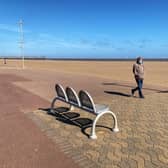 A lone walker wearing a mask on Skegness beach. Photo: John Byford.