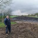 Farmer Gordon Stanley near the sewage heap on land near his home EMN-200204-141811001