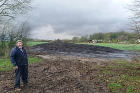 Farmer Gordon Stanley near the sewage heap on land near his home EMN-200204-141811001