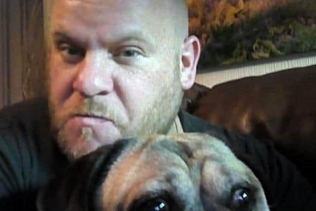 Carl Moore is recovering at home with his dog, Prince. ANL-200104-162833001