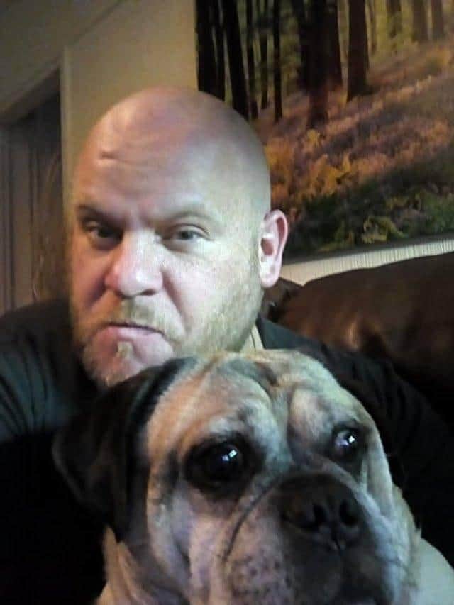 Carl Moore is recovering at home with his dog, Prince. ANL-200104-162833001
