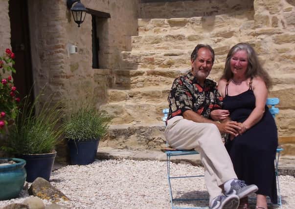 Greg and Sandra Perry outside their B&B business in Italy.