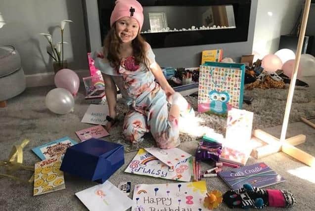 Rhiannon Berry with all her surprise birthday cards and treats. EMN-200304-104010001