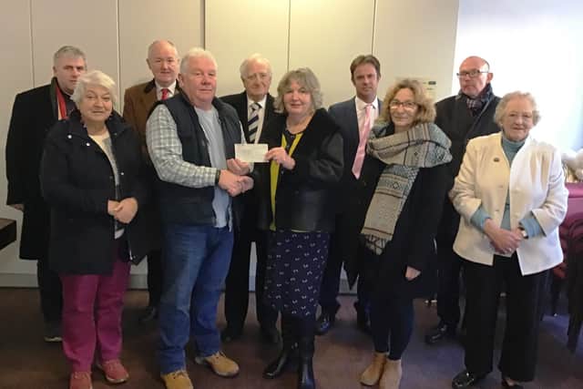 Trustees presented a £5,000 cheque to the Trinity Centre earlier this year.
