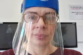 Head of technology at Boston High School, Emma Whitton, wearing one of the Enew face visors they created. EMN-201204-175723001