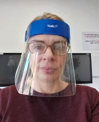 Head of technology at Boston High School, Emma Whitton, wearing one of the Enew face visors they created. EMN-201204-175723001