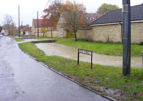 The Digby Beck, overflowing into Beck Street in November 2019 after heavy rain. EMN-200904-171935001