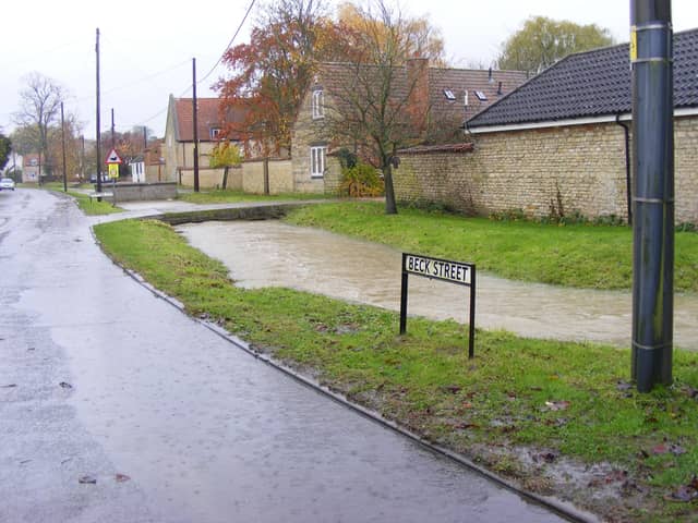 The Digby Beck, overflowing into Beck Street in November 2019 after heavy rain. EMN-200904-171935001
