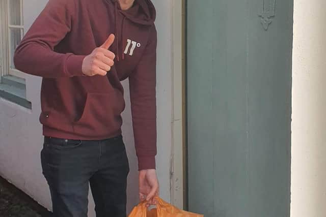 Volunteer Jordan Wilson delivering some shopping. ANL-200413-110349001