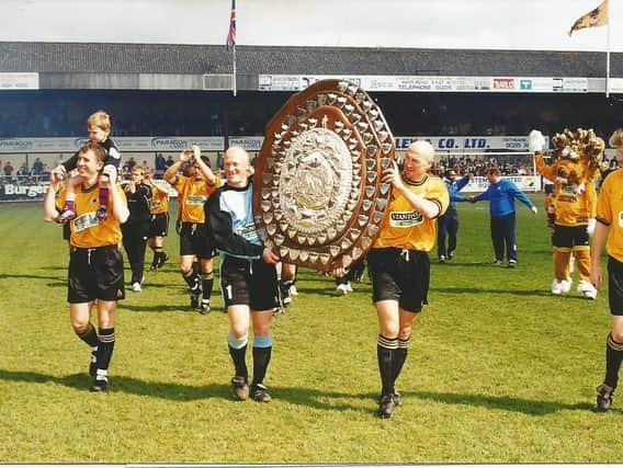 Paul Bastock and David Rennie parade the Dr Martens shield.