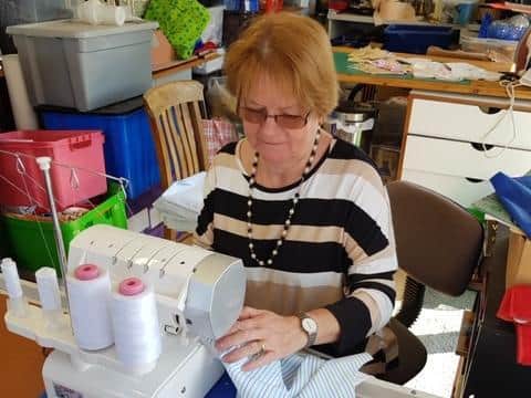 Carol Cawley of Burgh le Marsh sewing scrubs.