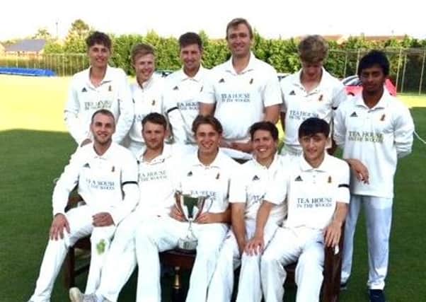 Woodhall Spa celebrate winning last year's Lincs ECB Premier title. This summer they have been clocking up the runs in a different way.