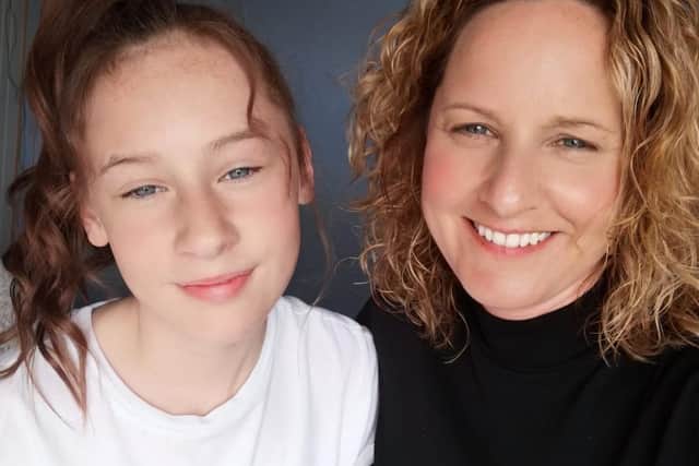 Vicky Limb (right) and her daughter, Felicity smiling at their achievement after a 24-hour danceathon.