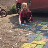 Sammy (6) with her rainbow paving for the NHS