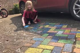 Sammy (6) with her rainbow paving for the NHS