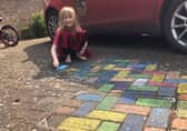 Sammy (6) with her rainbow paving for the NHS
