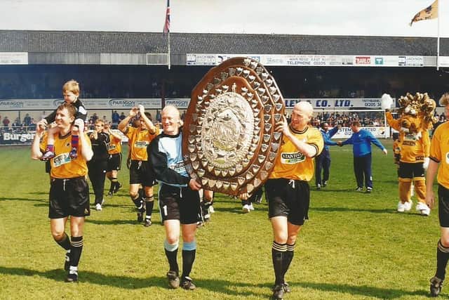 Parading the Dr Martens shield.