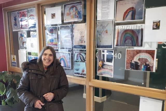 A resident called Kath at Barratt Court with some of the Rainbow entries already received.