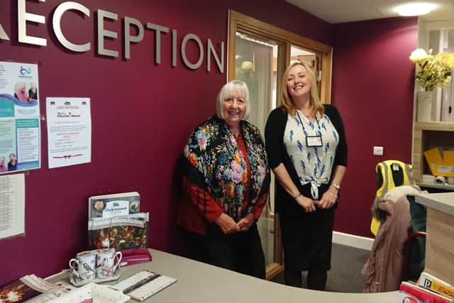 Hayley with resident Jill before lockdown. Now opportunities for socialising have stopped, Barratt Court is finding other ways to lift residents spirits while keeping them safe.