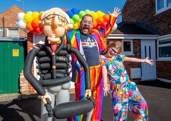 Balloon-tastic: Craig Cash  and daughter Olivia-Mae (9) with their first balloon art sculpture of Colonel Thomas Moore. Picture: John Aron.