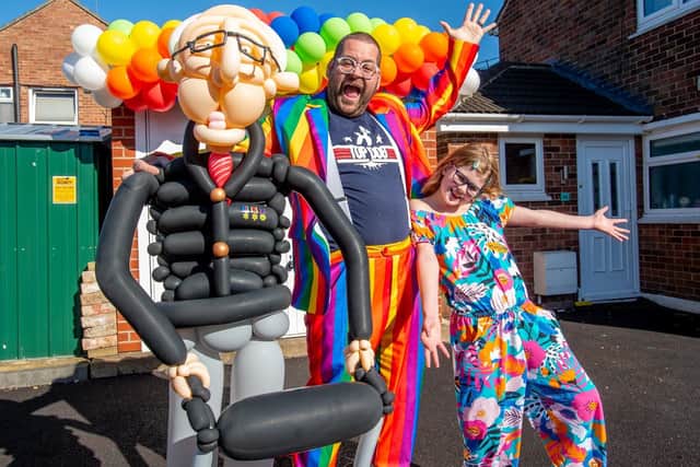Balloon-tastic: Craig Cash and daughter Olivia-Mae (9) with their first balloon art sculpture of Colonel Thomas Moore. Picture: John Aron.