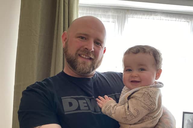 Mark Stones, 33, with his baby son Max.