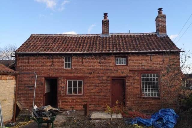 Mrs Smith's Cottage during restoration. EMN-200427-163838001
