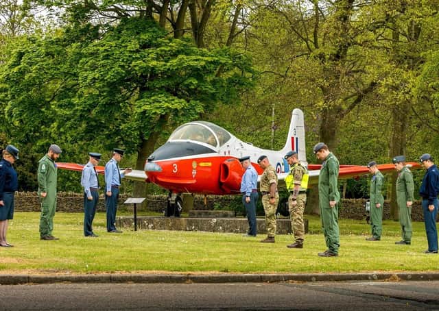 RAF College Cranwell personnel bow their heads for the minute's silence at 11am today for key workers who have died during the coronavirus pandemic. EMN-200428-153947001