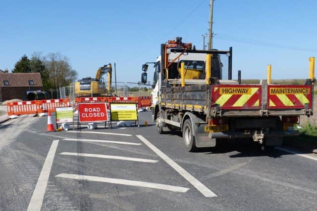 County council engineers working to repair the collapsed drain on the A153 over the weekend.