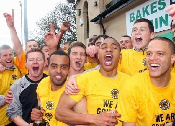 United celebrate winning the play-off final at the Horsfall Stadium.