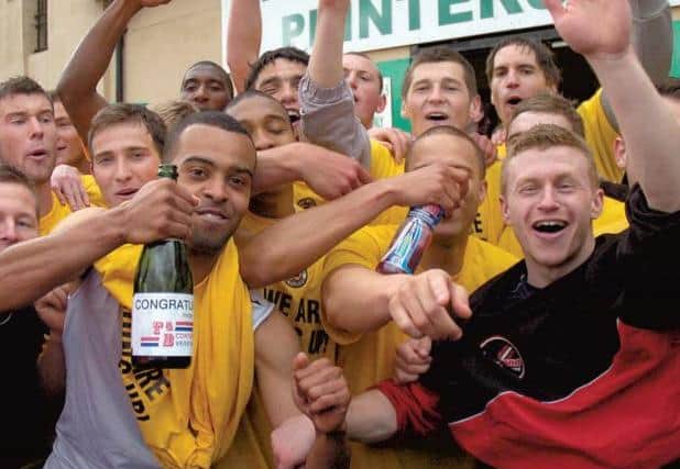 Boston celebrate their promotion.