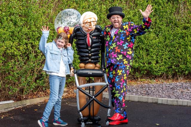 Craig Cash and Olivia-Mae with Colonel Tom Moore's 100th birthday present