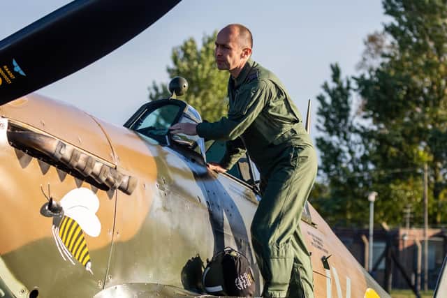 Squadron Leader Mark ‘Disco’ Discombe, who flew the Hurricane over Colonel Tom Moore’s house, checks the aircraft before flight. Picture: LAC Iwan Lewis. EMN-200430-120100001