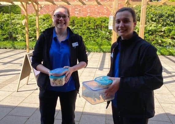Staff with the excess stock.