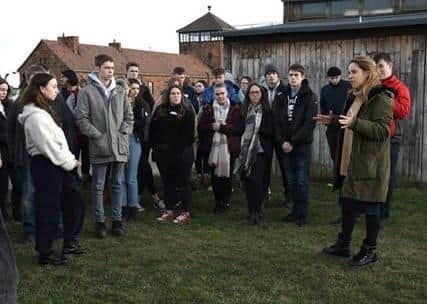 Charlie and the group visiting Auschwitz. Photo: LFA Photos. EMN-200430-185750001