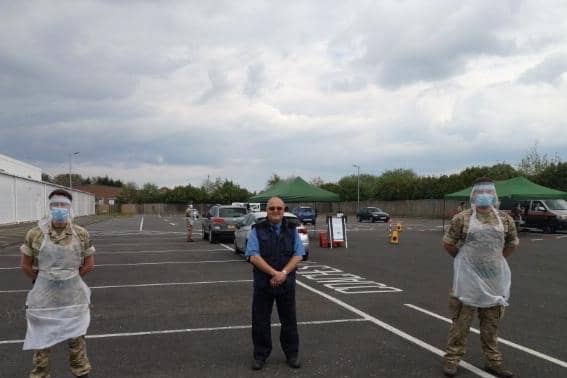 Soldiers of the 2nd Battalion The Royal Anglian Regiment (The Poachers) who have been testing at Tesco car park in Skegness, pictured with Coun Steve Walmsley.