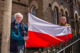 Horncastle’s Town and County Councillor Bill Aron (left) joins Simon Elmer to hoist the Polish flag at the town’s War Memorial Hospital Centre on Sunday.