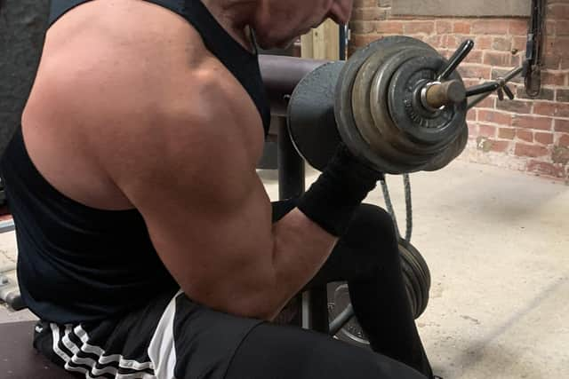 Mick keeping fit and healthy in his home gym.