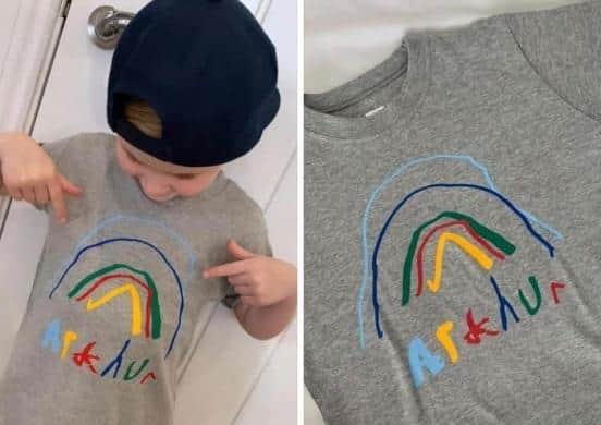 Arthur (5) models one of the  shirts, featuring his very own design.