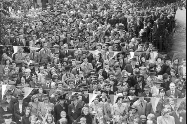 VE Day 1945. Grantham townspeople gathered on St Peter's Hill Green to celebrate the end of the Second World War.
This picture was taken by photographer Walter Lee from his studio next door to the State cinema. EMN-200505-171957001