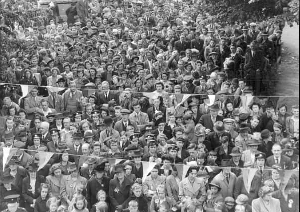 VE Day 1945. Grantham townspeople gathered on St Peter's Hill Green to celebrate the end of the Second World War.
This picture was taken by photographer Walter Lee from his studio next door to the State cinema. EMN-200505-171957001