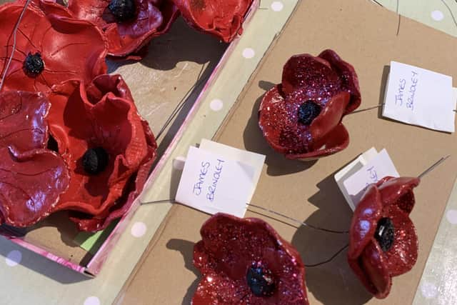 Clay poppies for the VE Day display in Leasingham. EMN-200705-093953001
