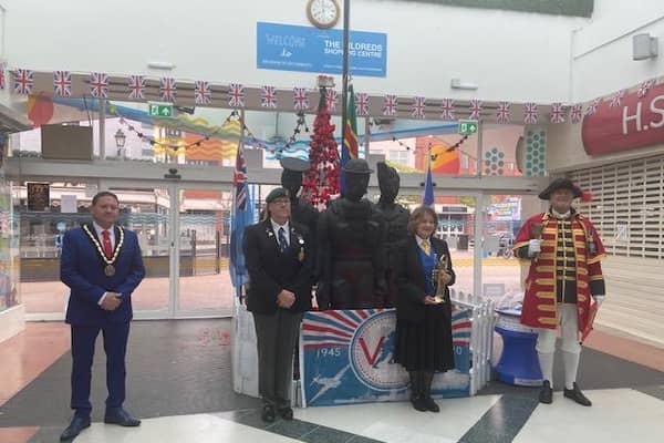 A small group met by the statue of Thre Fallen Three at the Hildreds Centre in Skegness this morning for the Town Crier's proclamation.