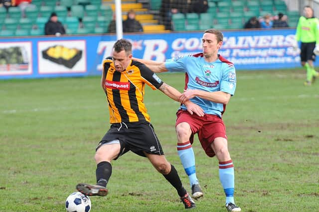 Ross holds off his marker against Colwyn Bay.