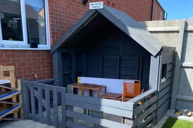 Abi Vickers and her partner built a playhouse out of pallet for their children, as well as mini water parks and rainbow painting. EMN-201005-170724001